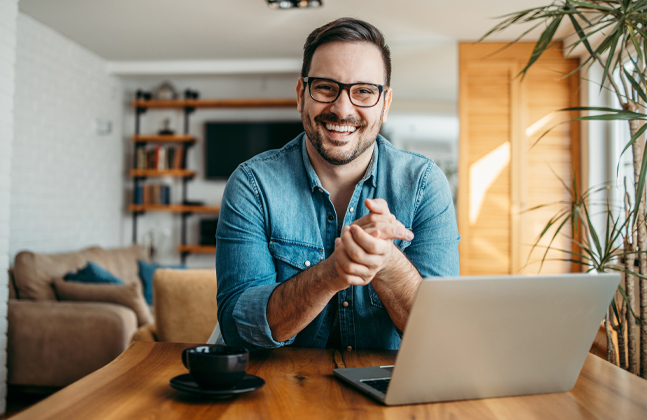 Man smiling on computer