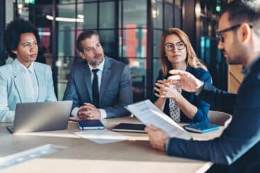 Business meeting with diverse professionals. outsourcing best for businesses