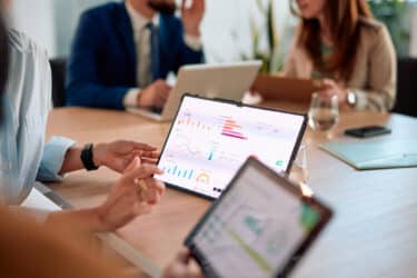 Business meeting with data analysis tools. eCommerce Trends for 2026